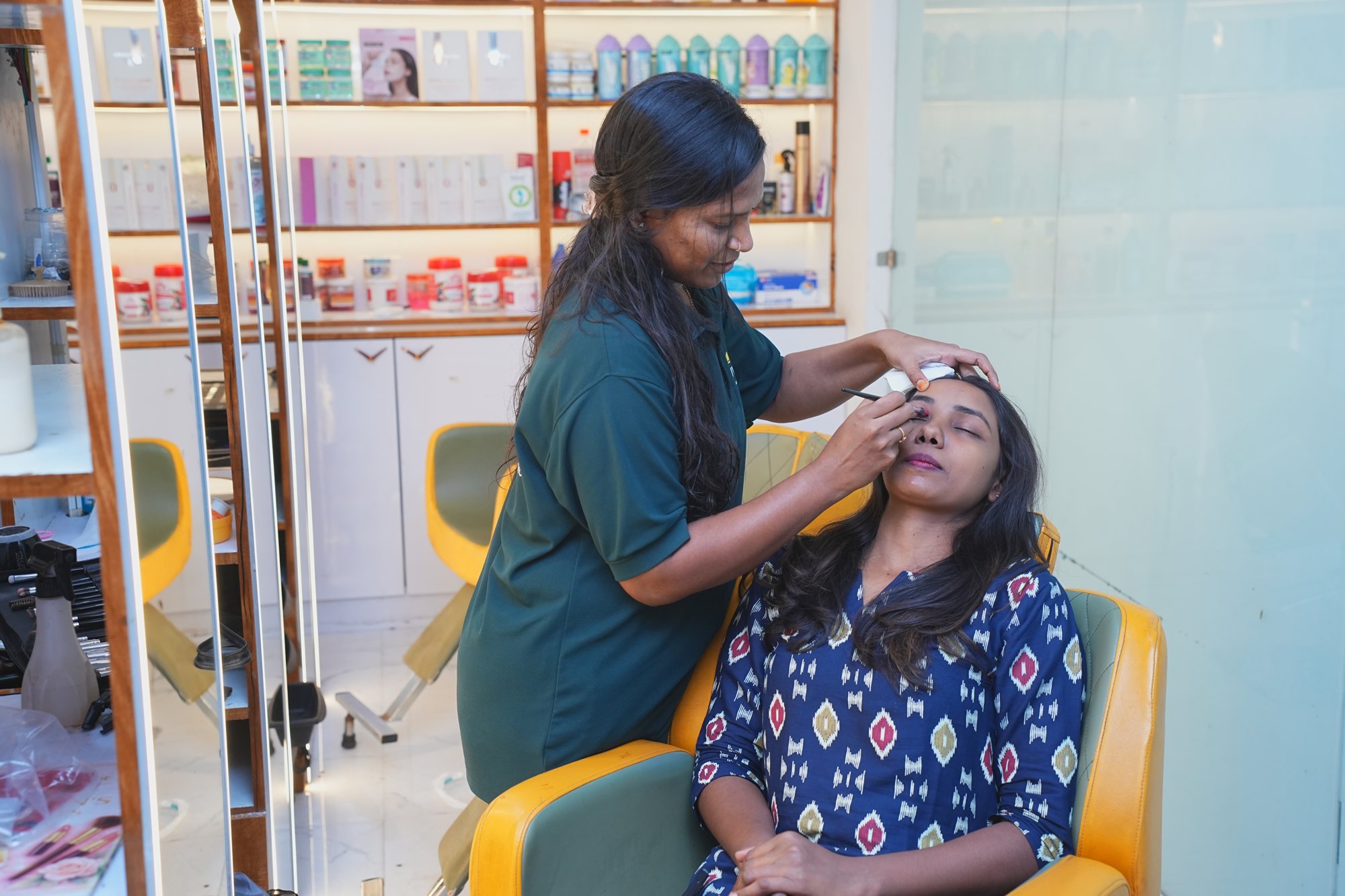 Brow grooming service being performed